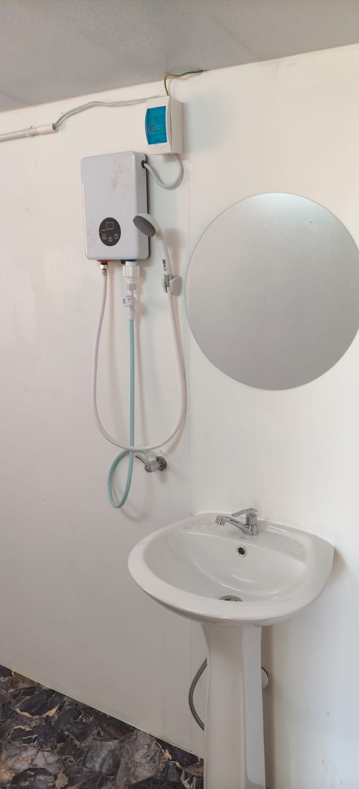 Clean private bathroom with hot water shower