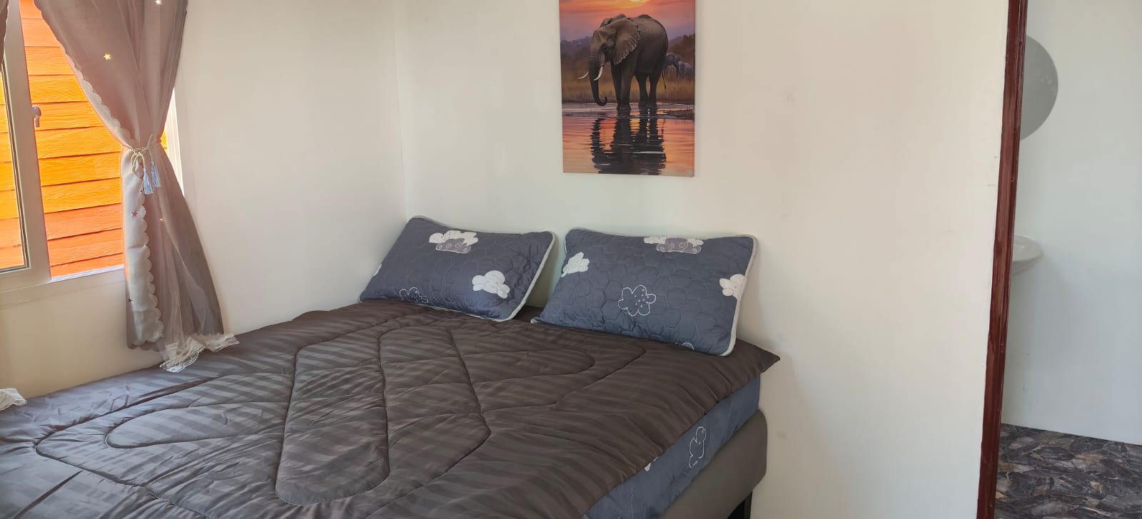 Comfortable bedroom with double bed and Thai decor