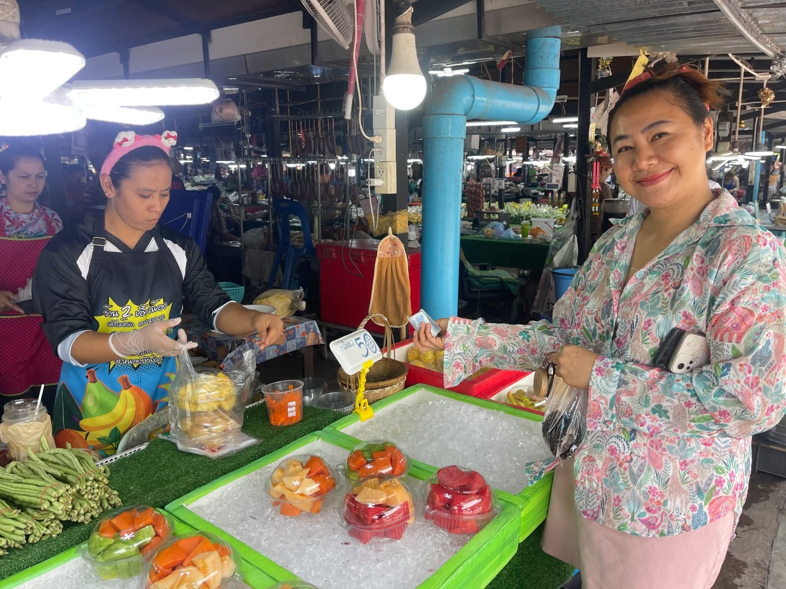 Friendly fruit vendor at market